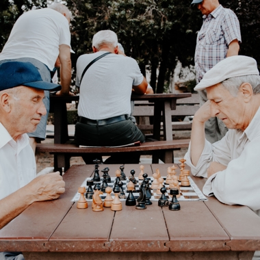 elderly men playing chess